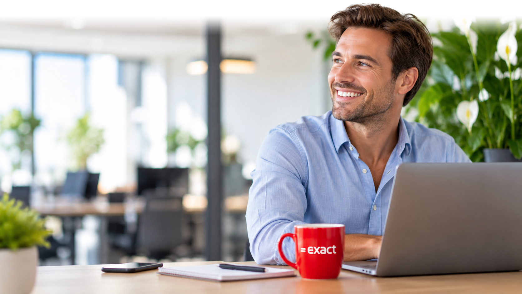 man sitting at a laptop
